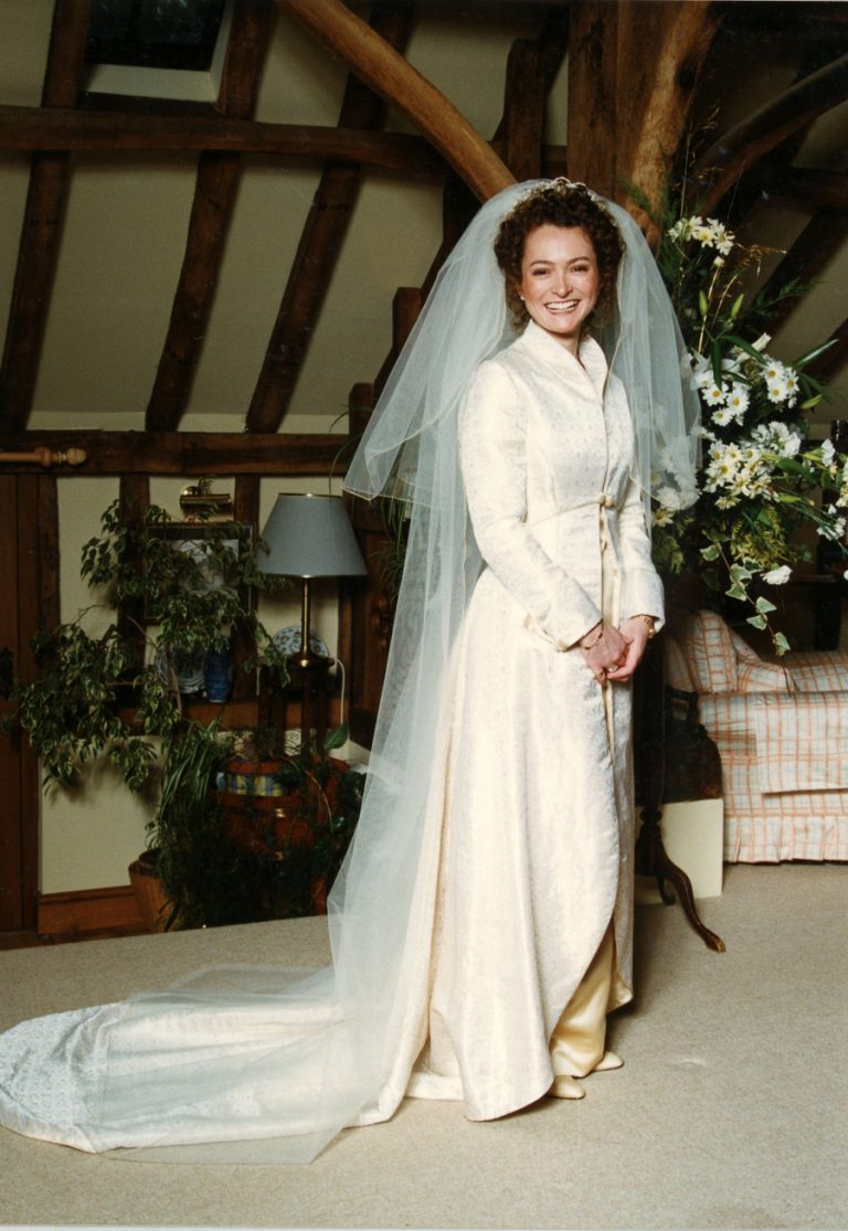 Winter wedding gown and coat with veil by Joanna Bell
