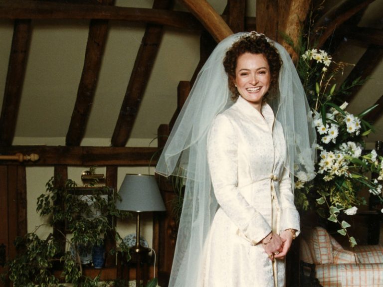 Winter wedding gown and coat with veil by Joanna Bell